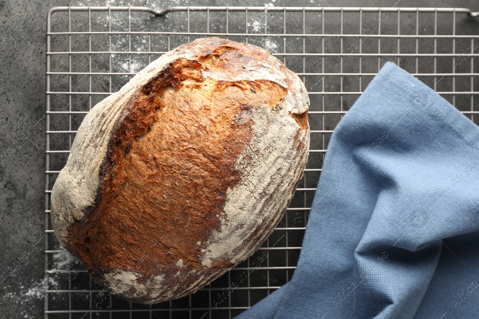 Photo of Freshly baked bread on grey table, top view