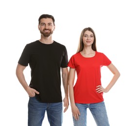 Photo of Woman and man wearing blank t-shirts on white background. Mockup for design