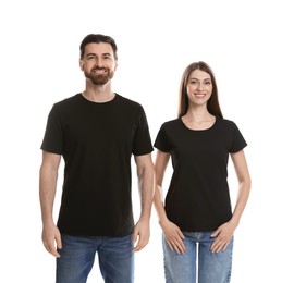 Photo of Woman and man wearing blank black t-shirts on white background. Mockup for design