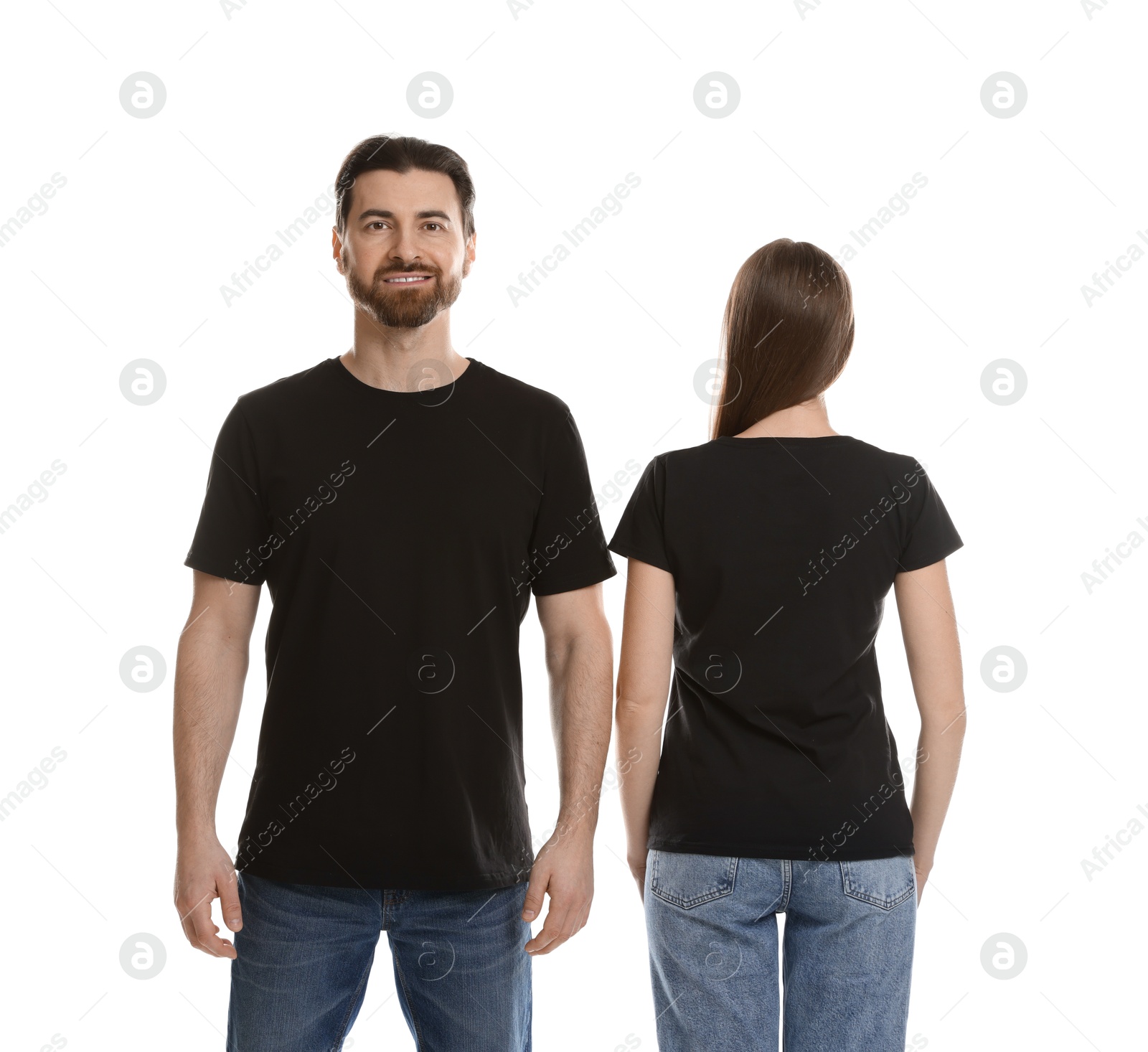 Photo of Woman and man wearing blank black t-shirts on white background. Mockup for design