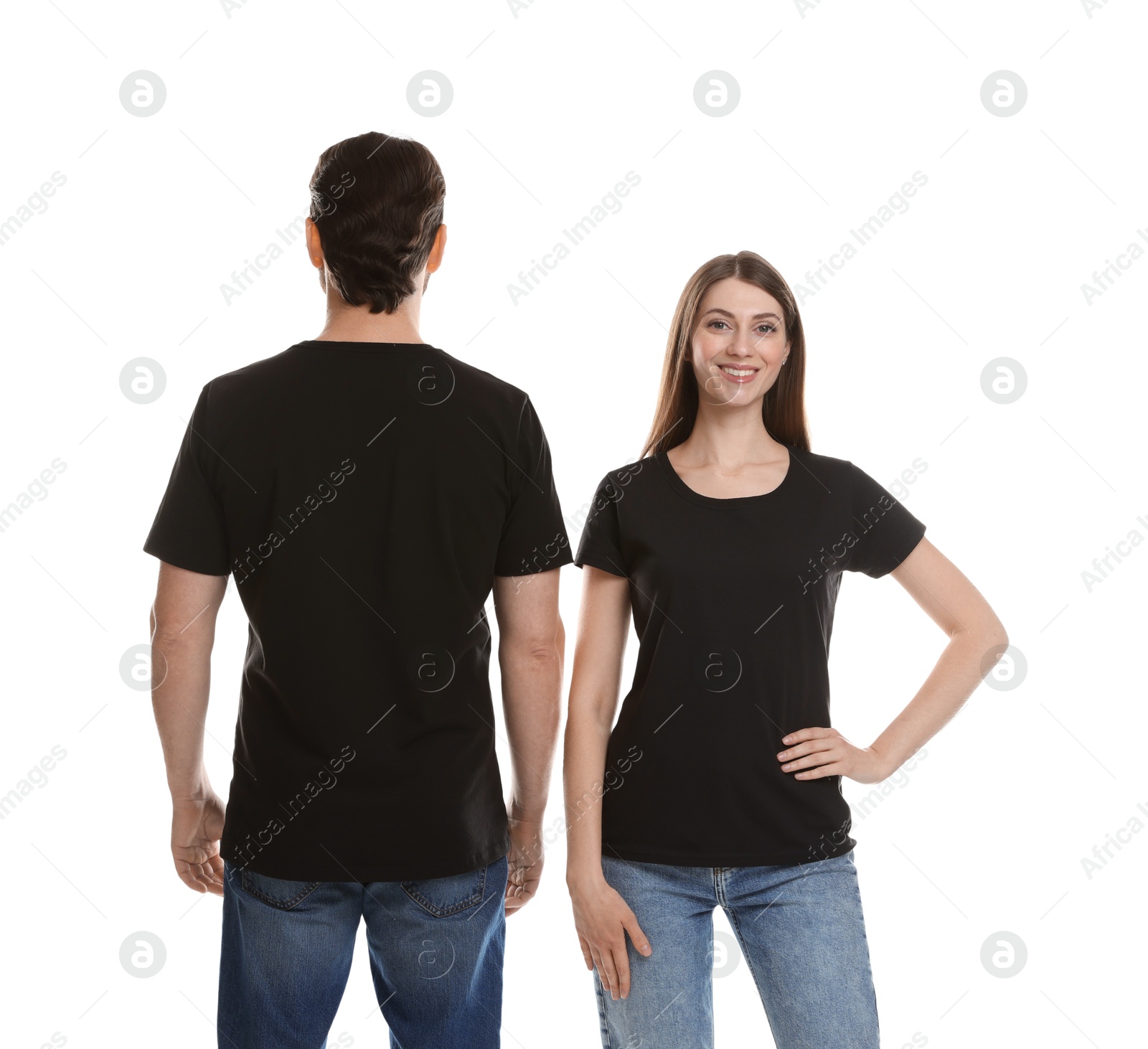 Photo of Woman and man wearing blank black t-shirts on white background. Mockup for design