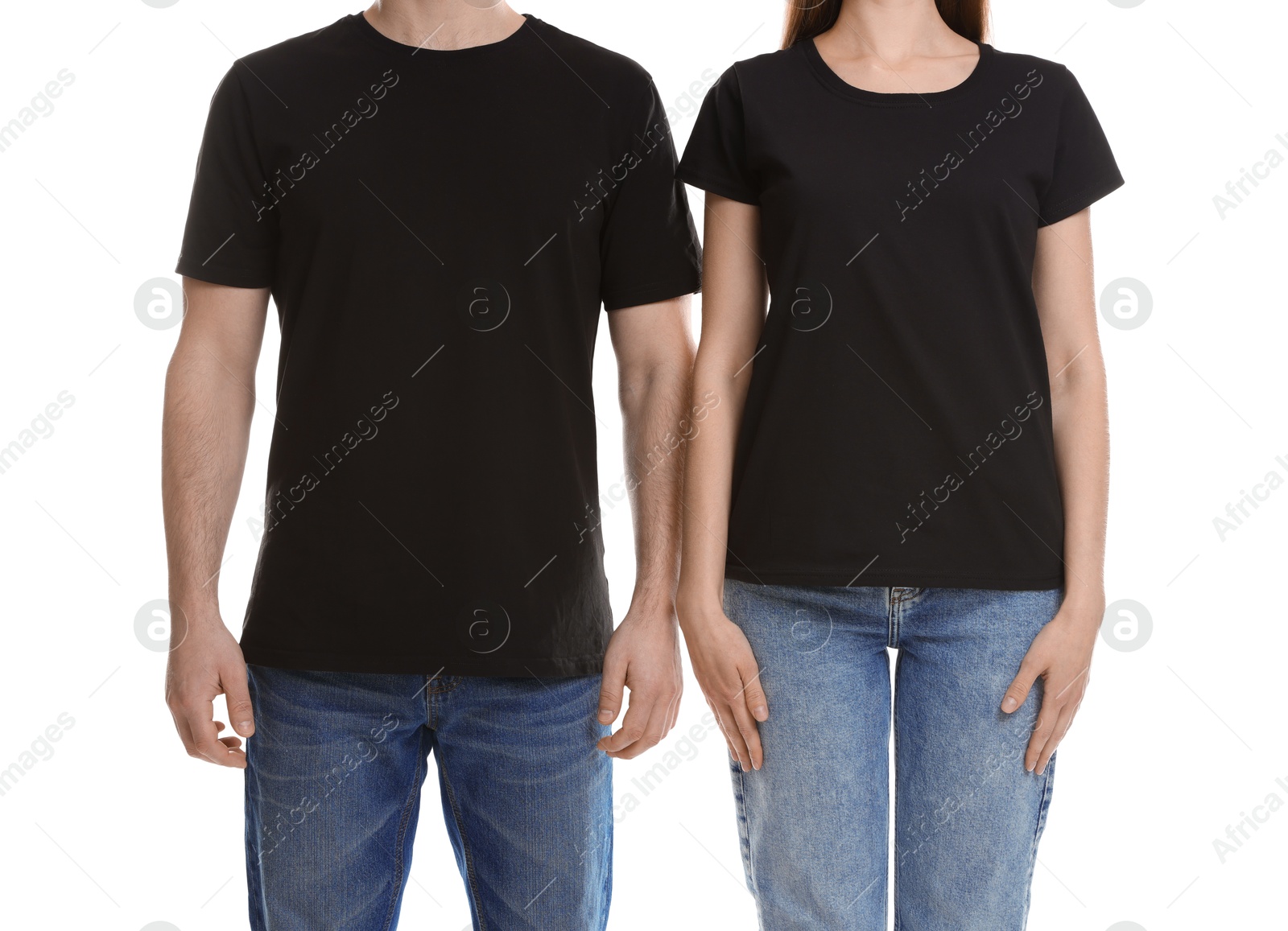 Photo of Woman and man wearing blank black t-shirts on white background, closeup. Mockup for design