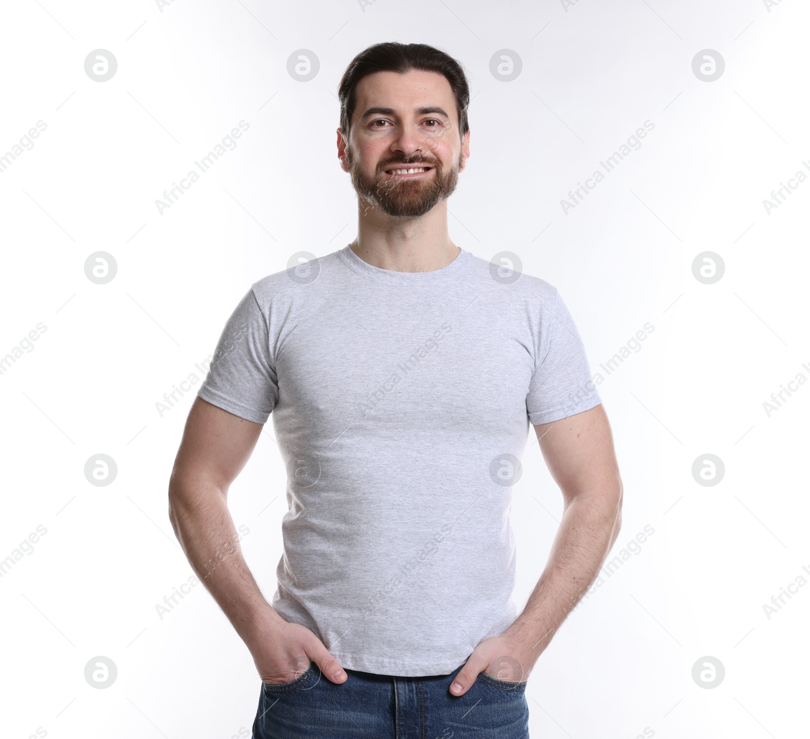 Photo of Man wearing blank t-shirt on white background. Mockup for design