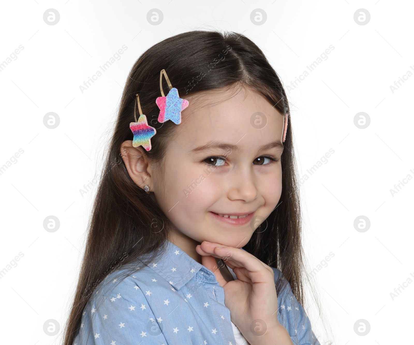 Photo of Happy little girl wearing beautiful hair accessories on white background