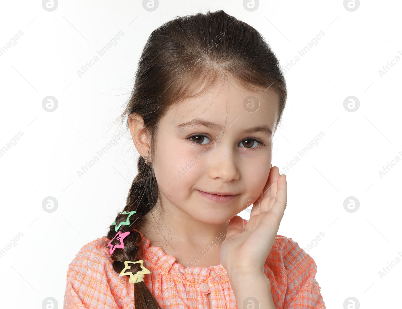 Photo of Little girl wearing beautiful hair accessories on white background