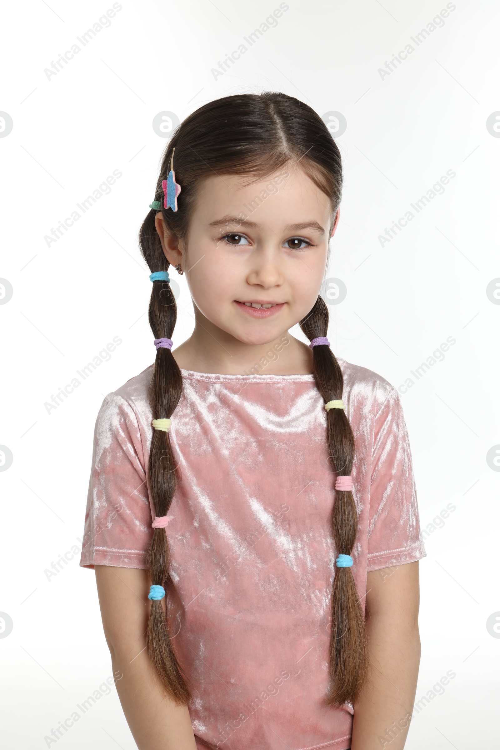 Photo of Little girl wearing beautiful hair accessories on white background