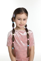 Photo of Little girl wearing beautiful hair accessories on white background