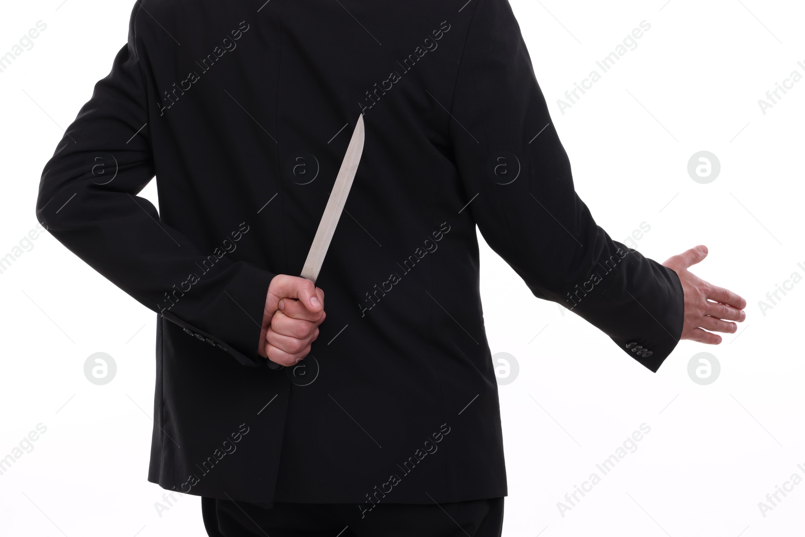 Photo of Businessman holding knife behind his back and offering handshake on white background, closeup