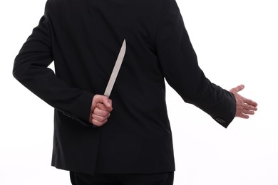 Photo of Businessman holding knife behind his back and offering handshake on white background, closeup