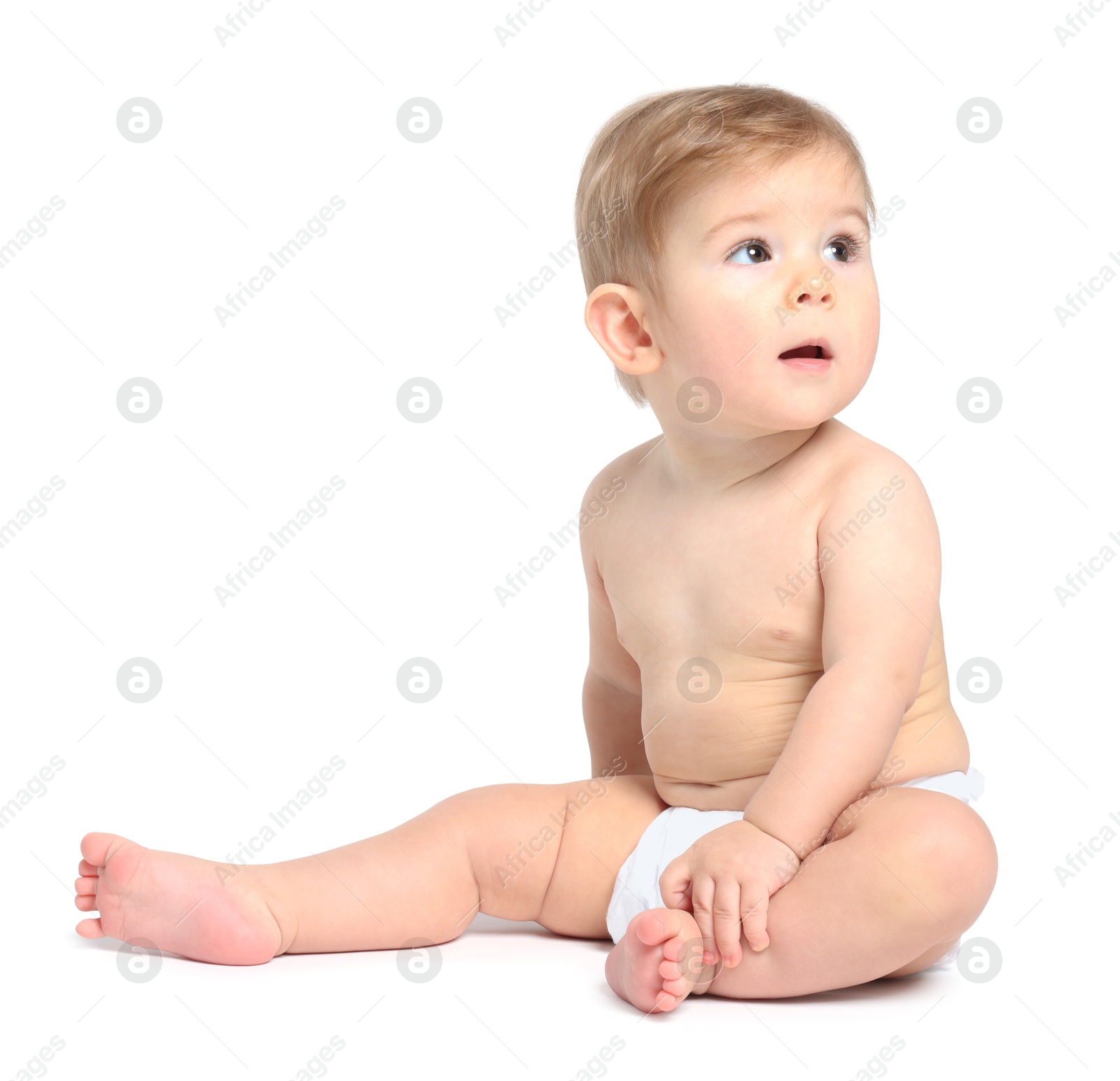 Photo of Cute little baby sitting on white background