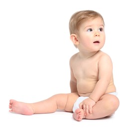 Cute little baby sitting on white background