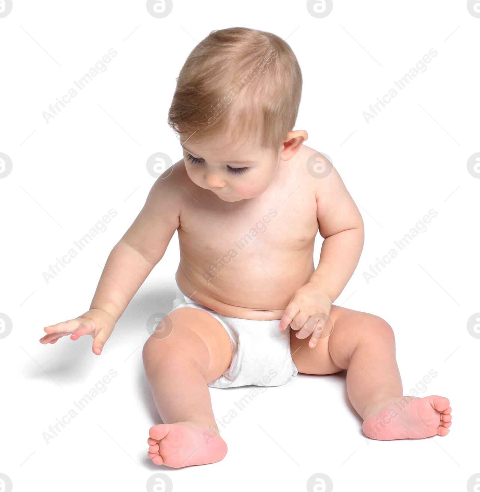 Photo of Cute little baby sitting on white background