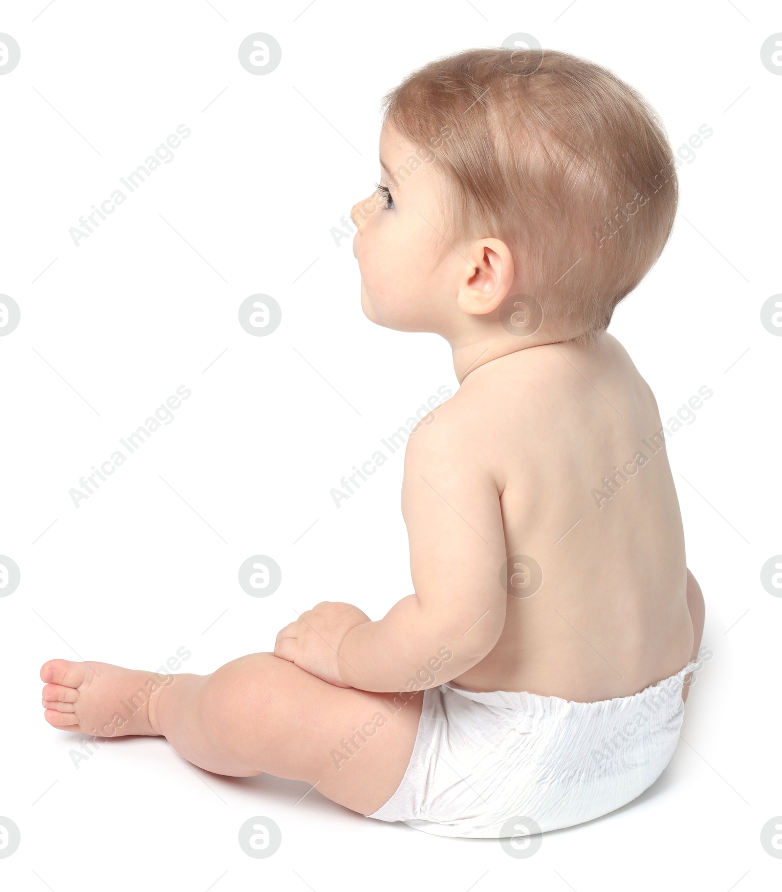 Photo of Cute little baby sitting on white background