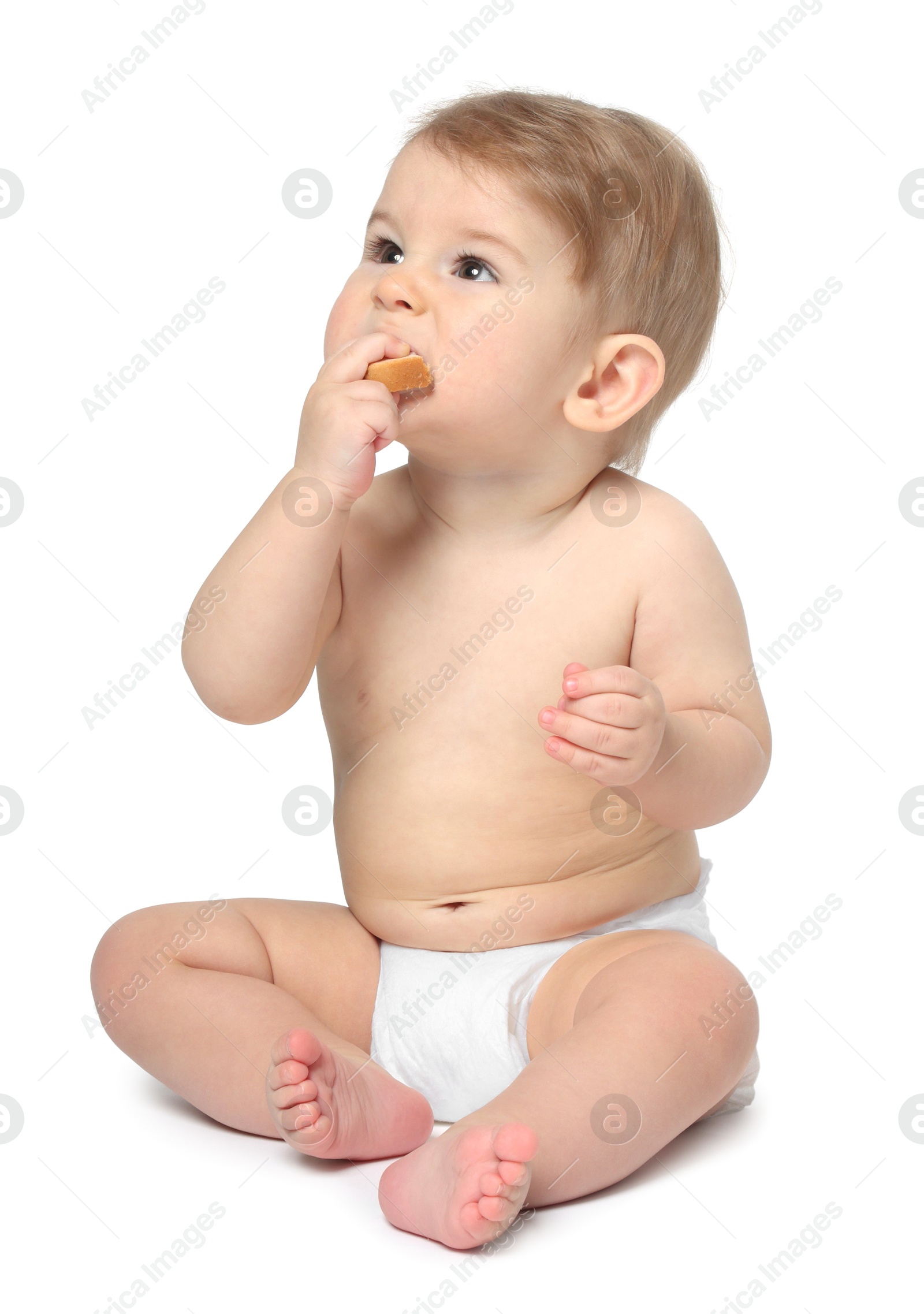 Photo of Cute little baby sitting on white background