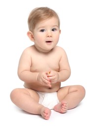 Cute little baby sitting on white background