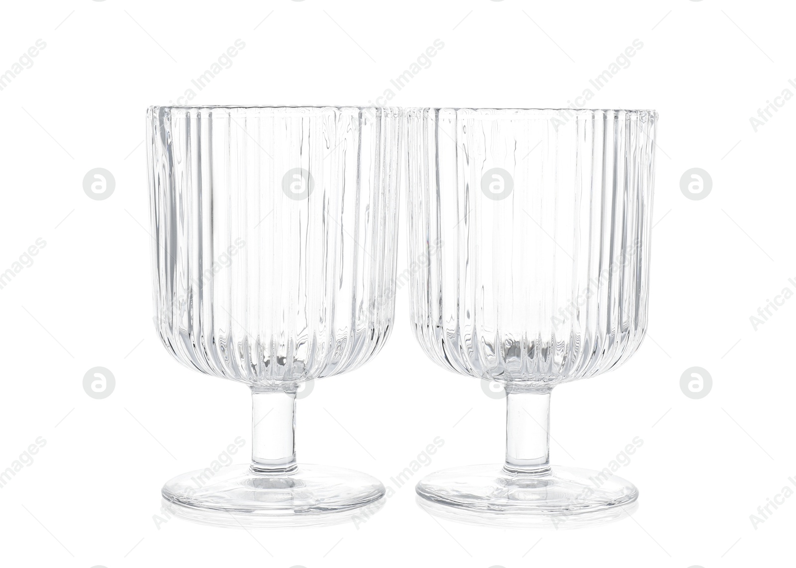 Photo of Two empty clean glasses isolated on white