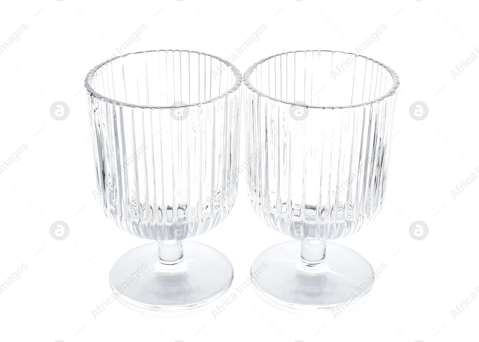 Photo of Two empty clean glasses isolated on white