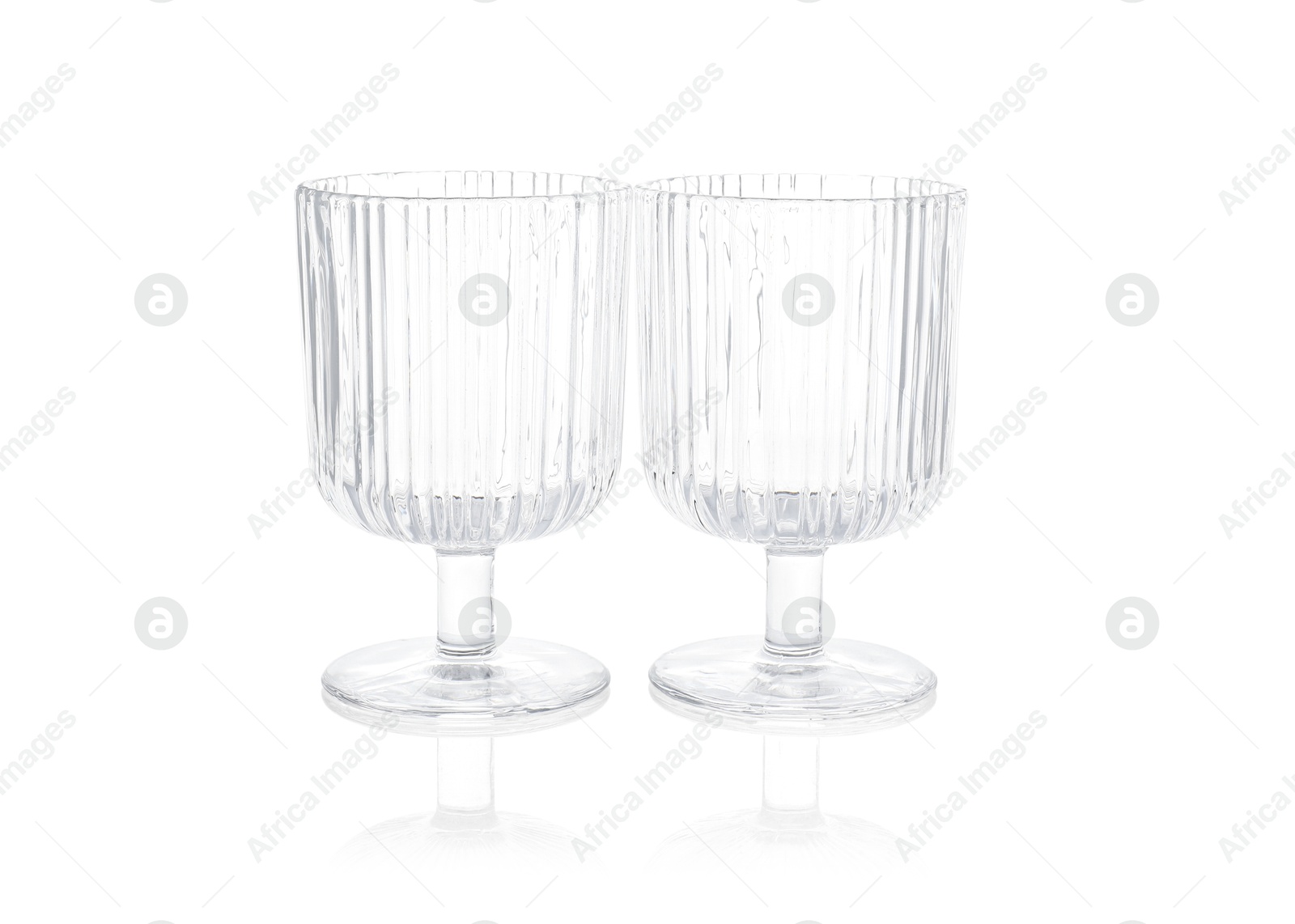 Photo of Two empty clean glasses isolated on white