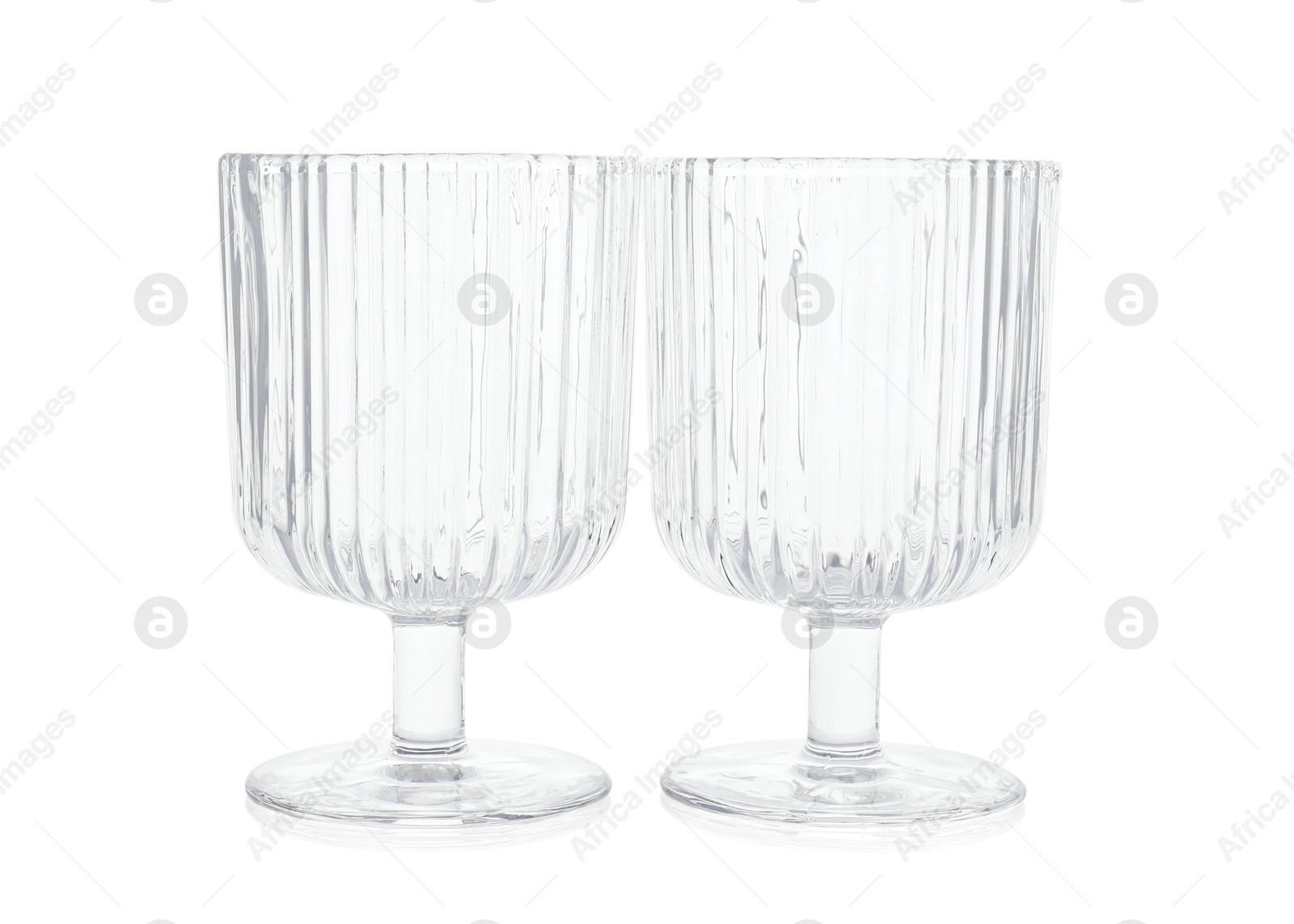 Photo of Two empty clean glasses isolated on white