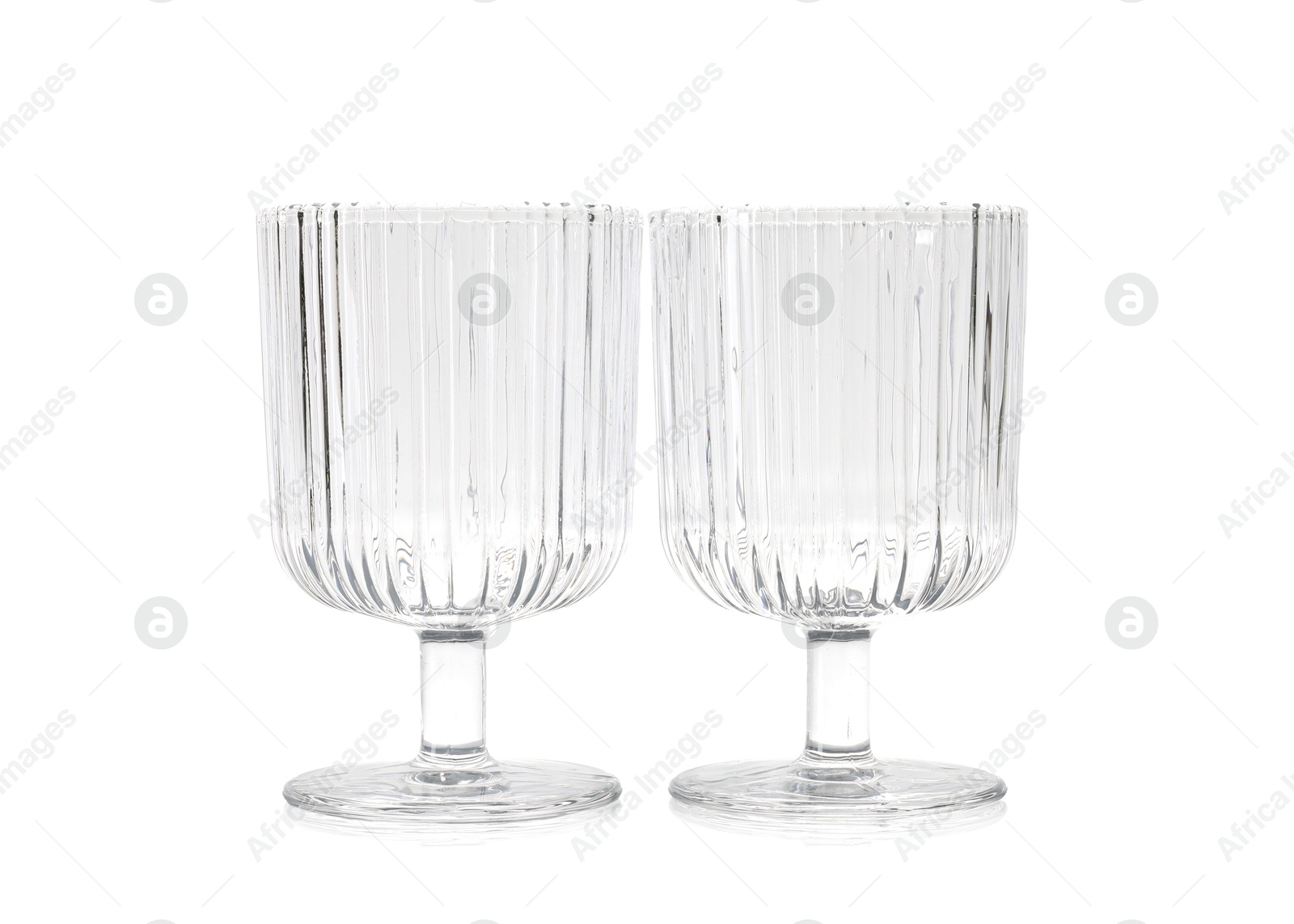 Photo of Two empty clean glasses isolated on white