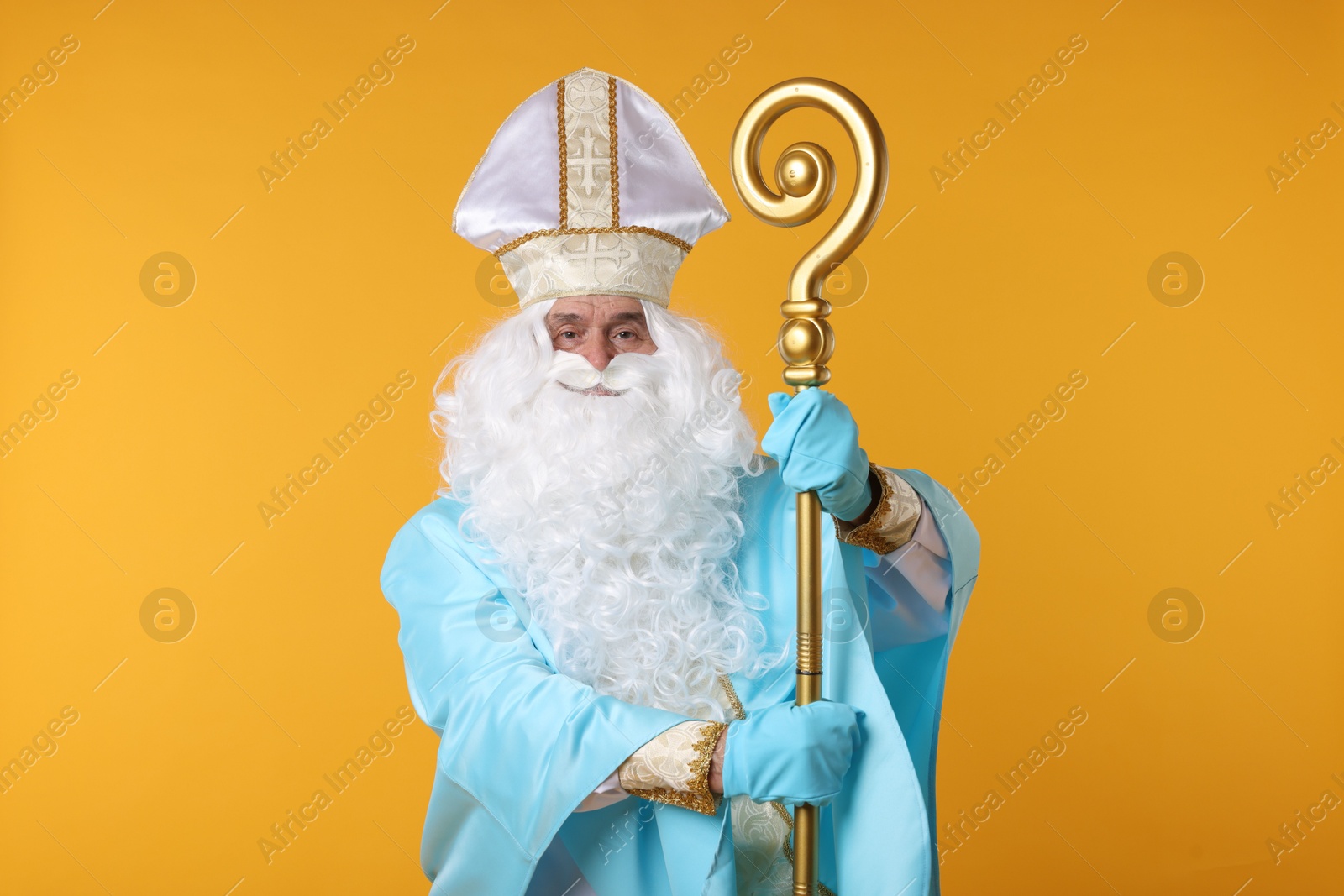 Photo of Saint Nicholas with crozier on orange background