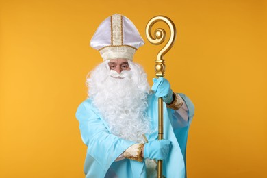 Photo of Saint Nicholas with crozier on orange background