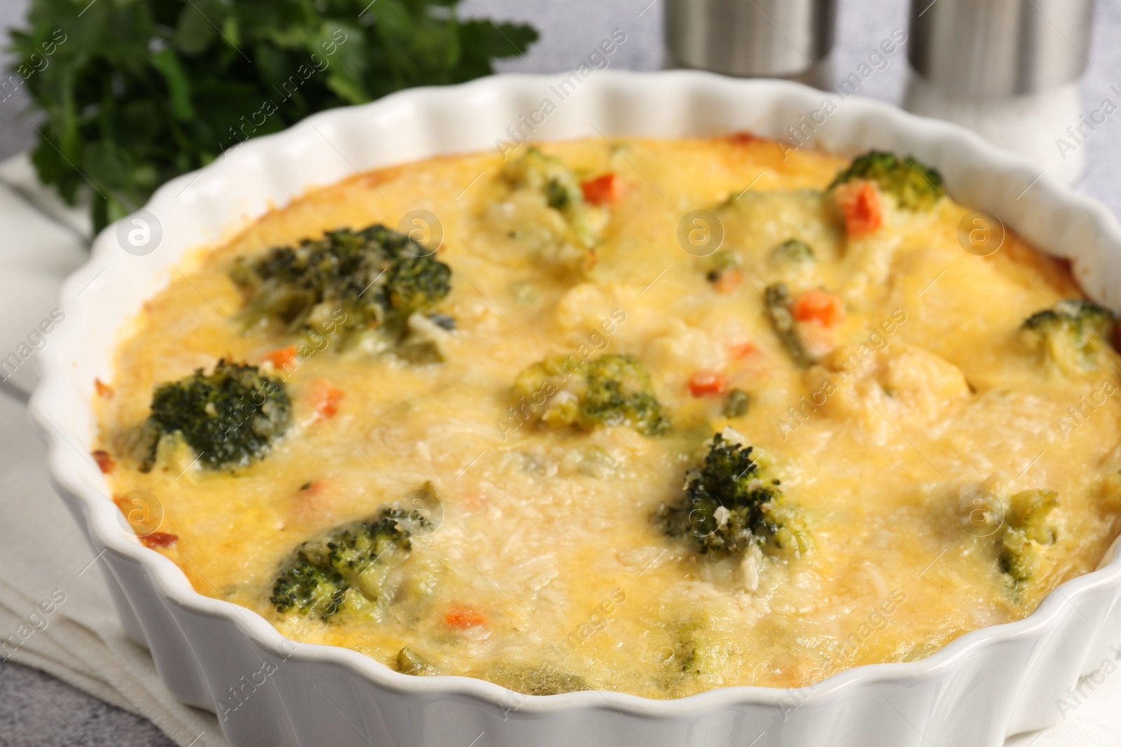 Photo of Delicious vegetable casserole on light table, closeup