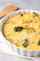 Photo of Delicious vegetable casserole on light table, closeup