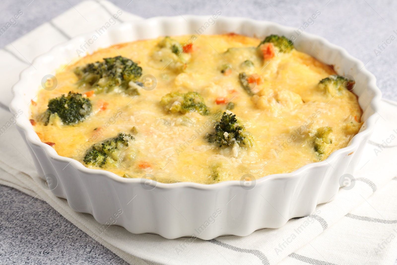 Photo of Delicious vegetable casserole on light table, closeup