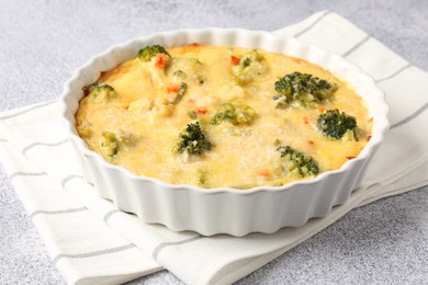 Photo of Delicious vegetable casserole on light table, closeup