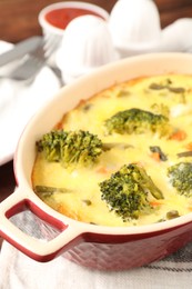 Photo of Delicious vegetable casserole on wooden table, closeup