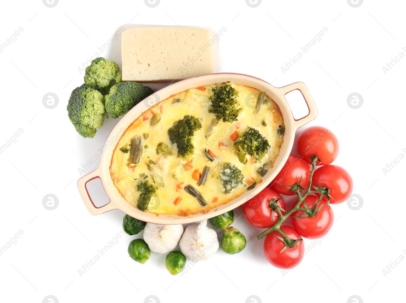 Photo of Delicious vegetable casserole and ingredients isolated on white, top view