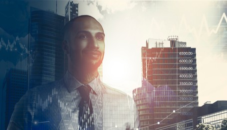 Image of Business success. Multiple exposure of man, graphs and cityscape