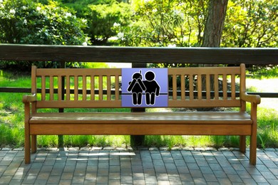 Image of Place where you can receive or give emotional support. Sign with human figures on bench outdoors