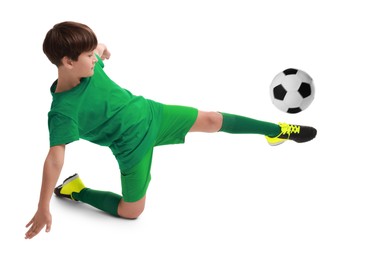 Image of Football player in sportswear kicking soccer ball on white background