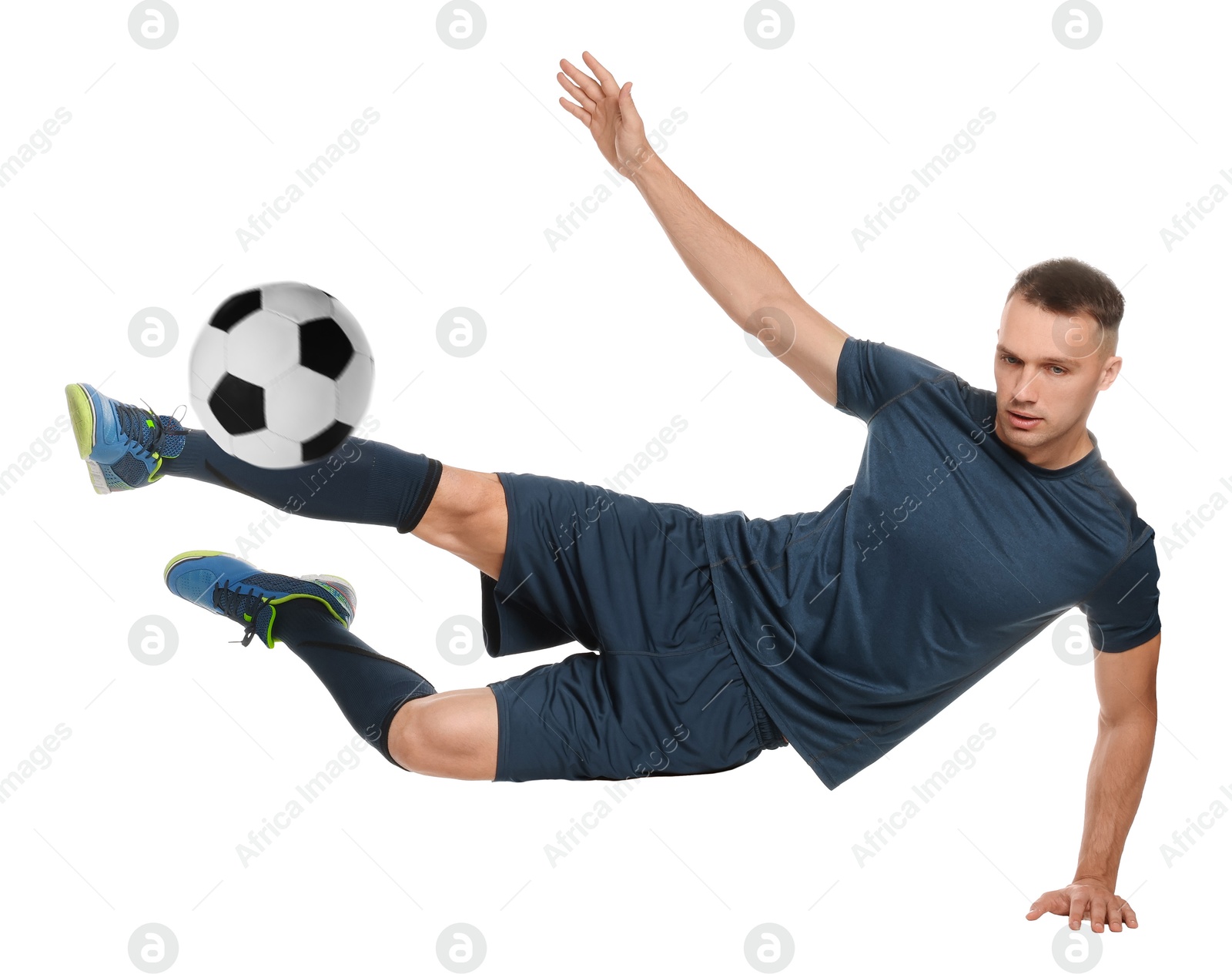 Image of Football player in sportswear kicking soccer ball on white background