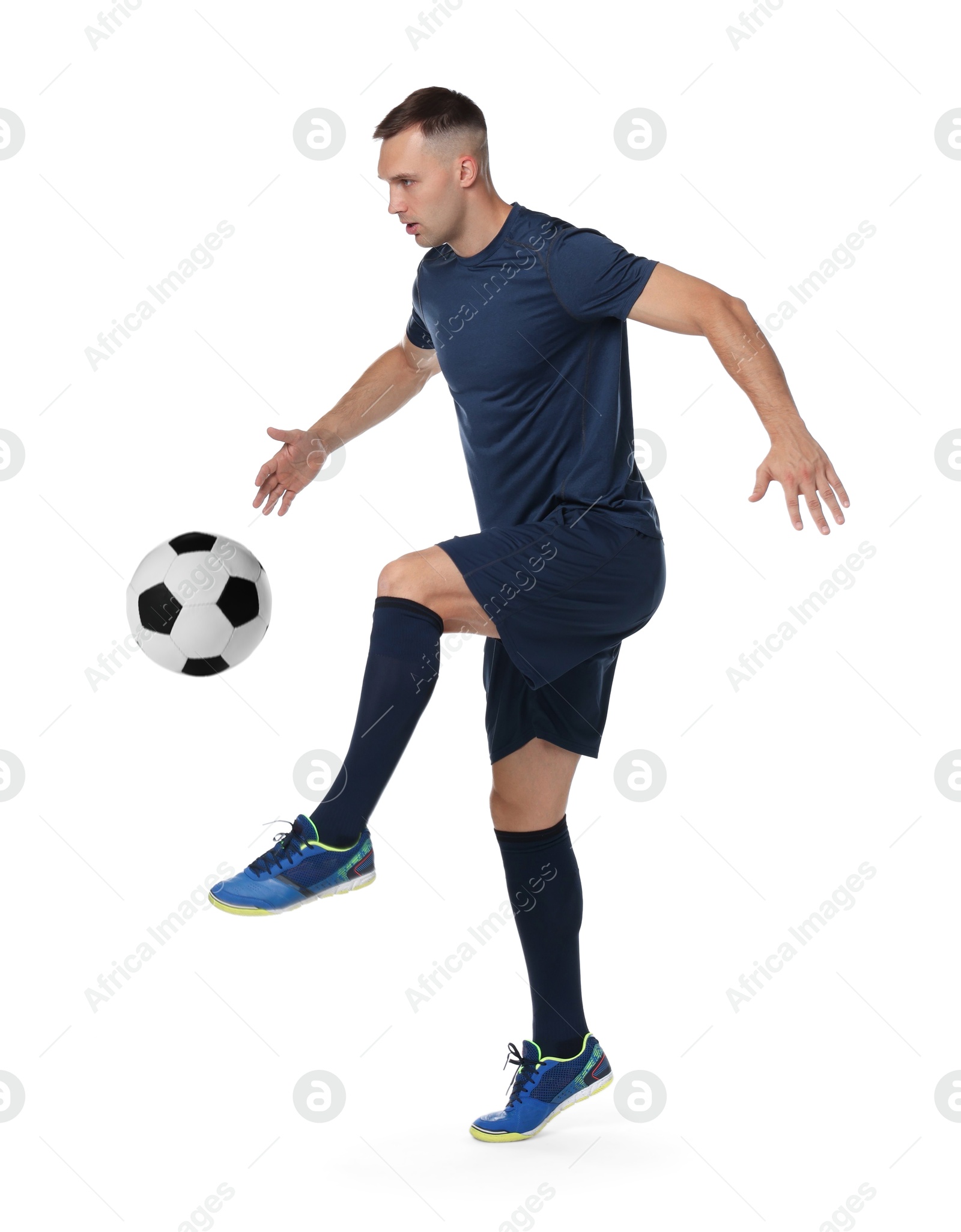 Image of Football player in sportswear kicking soccer ball on white background