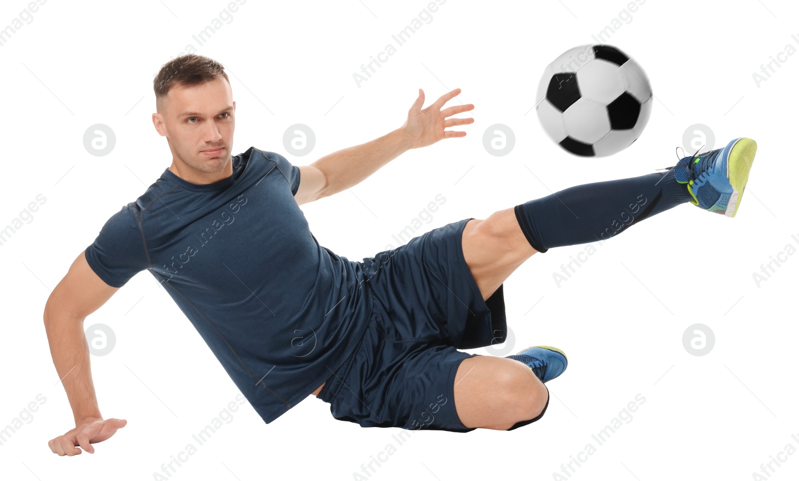 Image of Football player in sportswear kicking soccer ball on white background