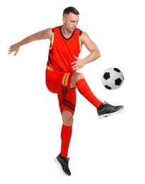 Image of Football player in sportswear kicking soccer ball on white background