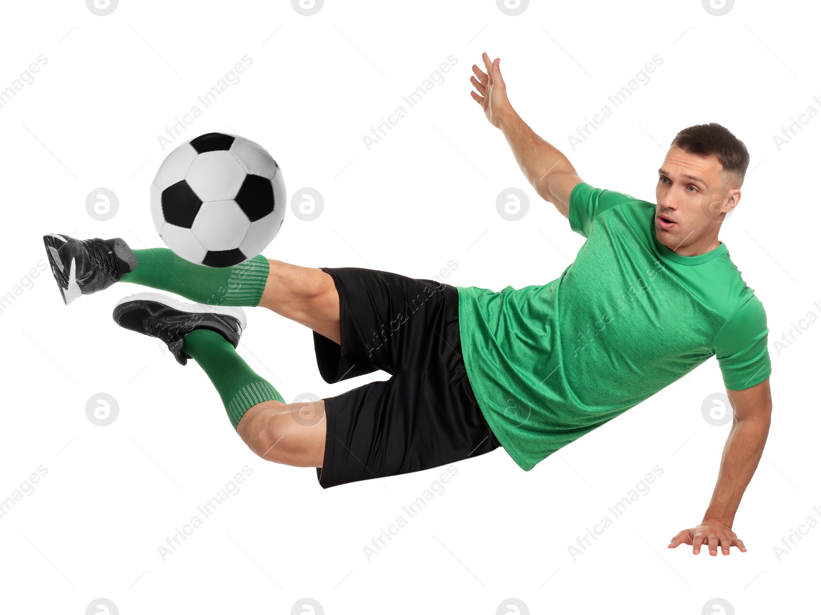 Image of Football player in sportswear kicking soccer ball on white background