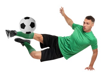 Image of Football player in sportswear kicking soccer ball on white background