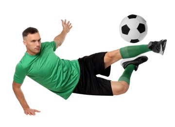 Image of Football player in sportswear kicking soccer ball on white background