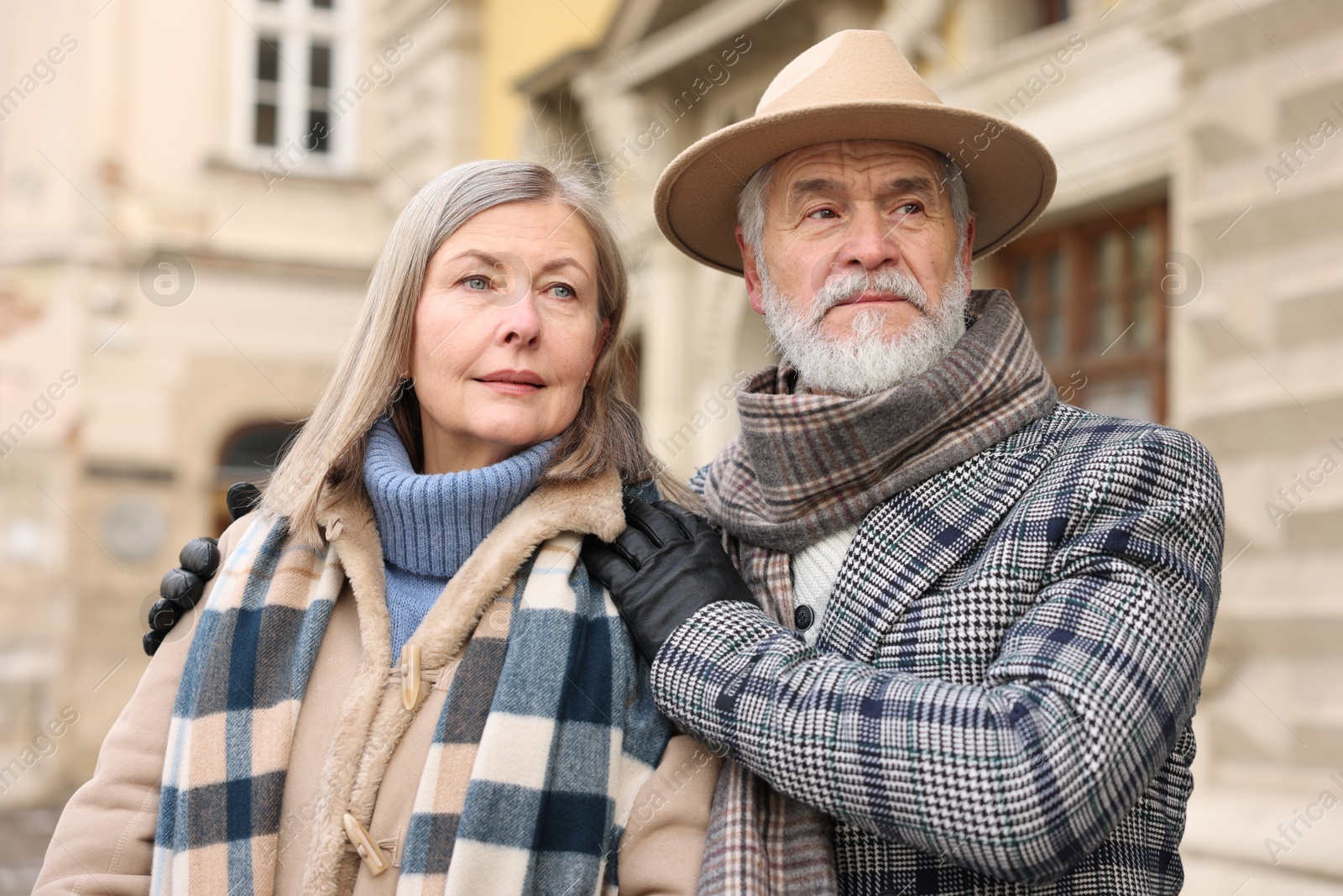 Photo of Lovely elderly couple together on city street