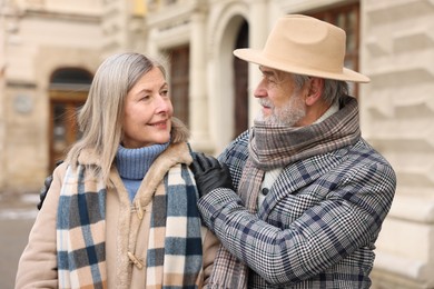 Photo of Lovely elderly couple together on city street