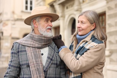 Photo of Lovely elderly couple together on city street