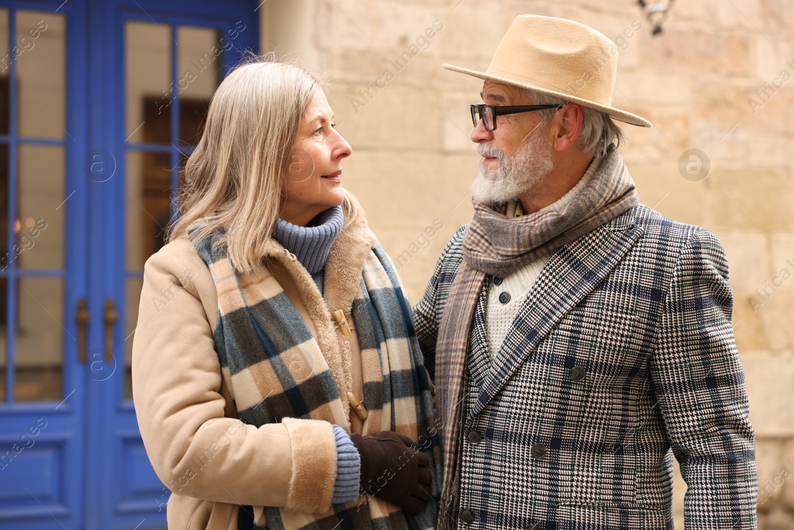 Photo of Lovely elderly couple together on city street