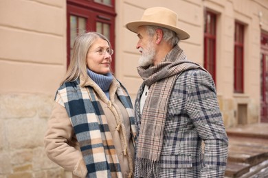 Photo of Lovely elderly couple together on city street