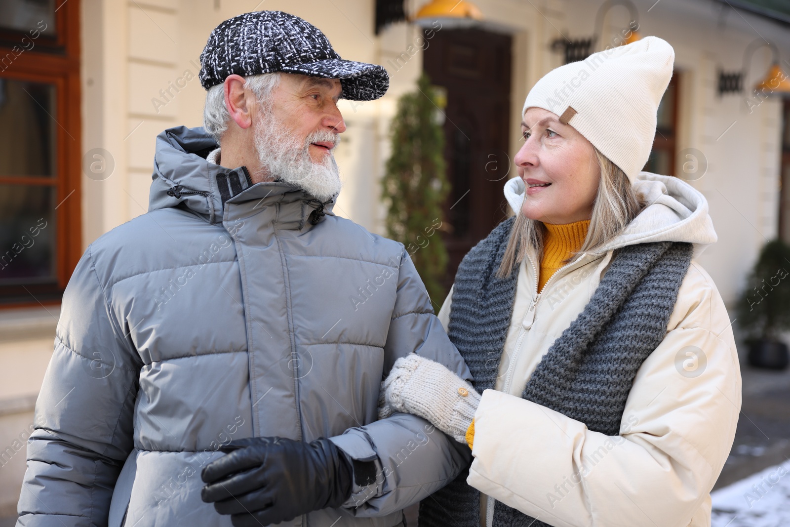 Photo of Lovely elderly couple together on city street