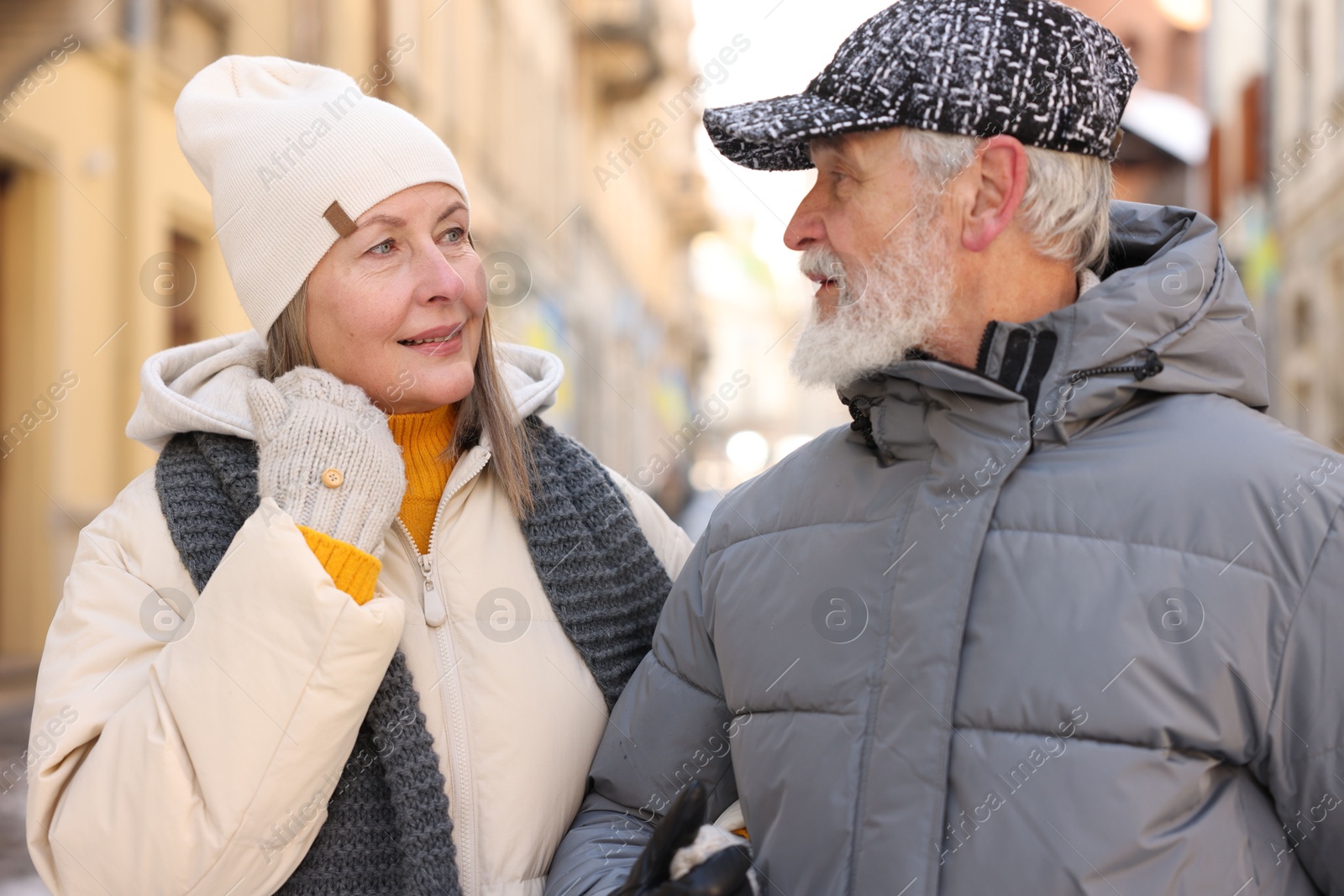 Photo of Lovely elderly couple together on city street