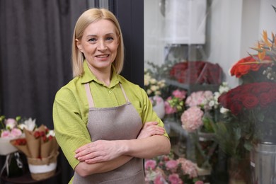 Photo of Happy business owner in her flower shop